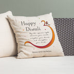 Decorative pillow with 'Happy Diwali' message on a couch