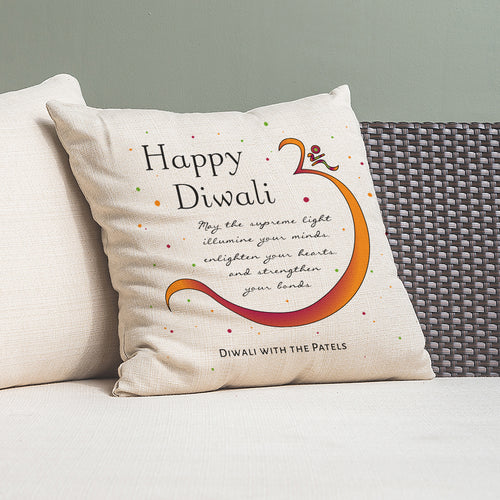 Decorative pillow with 'Happy Diwali' message on a couch
