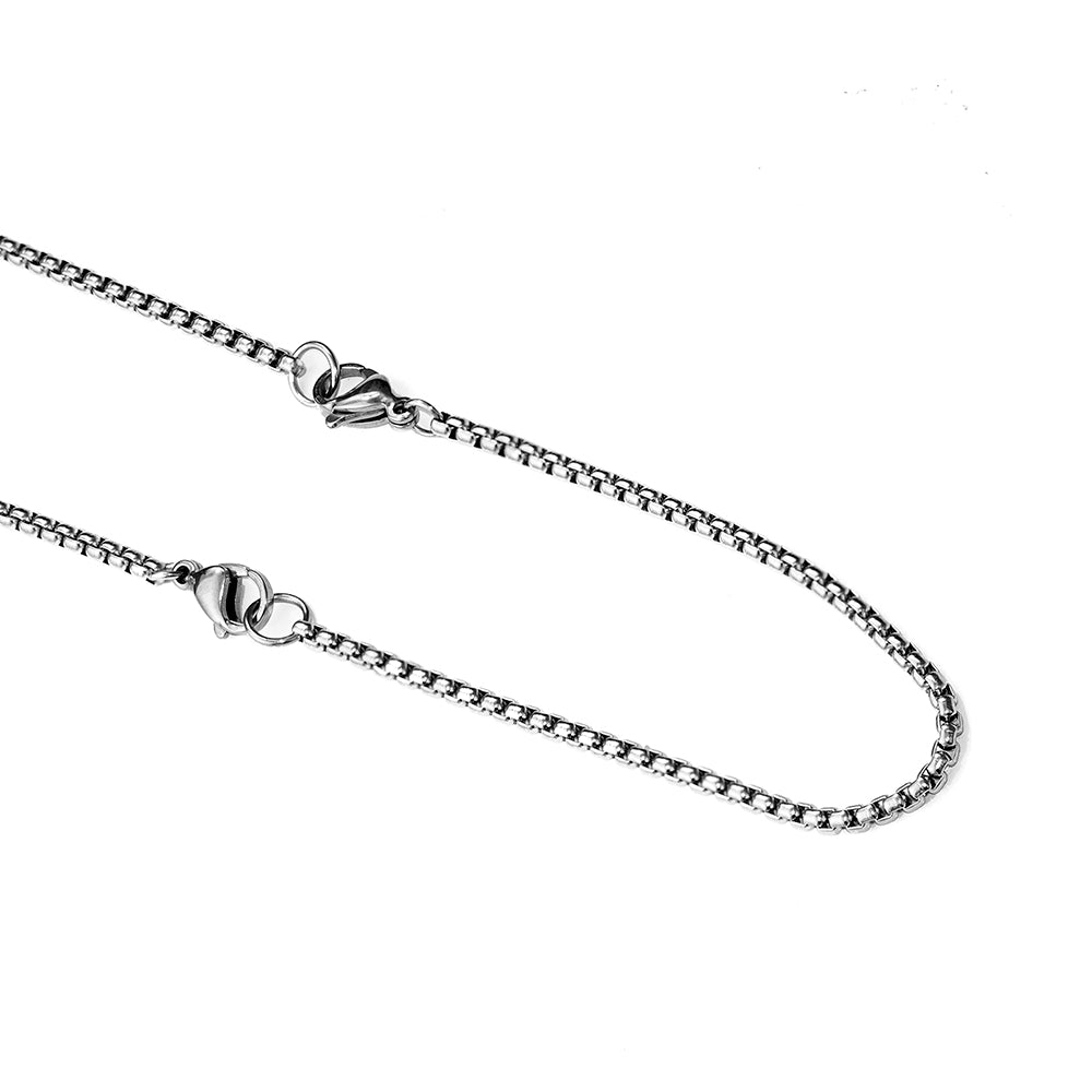 Silver chain necklace on a white background