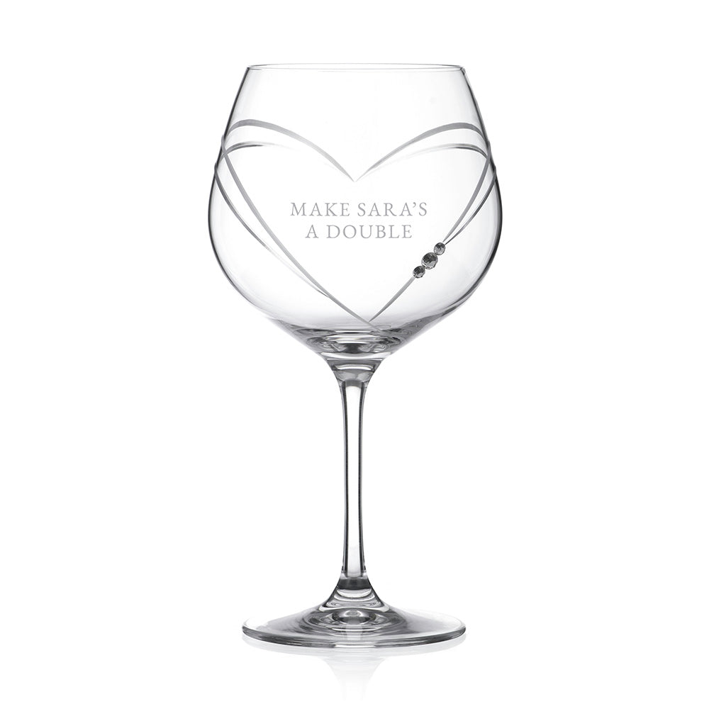 Clear wine glass with 'OLIVIA' engraved on a white background