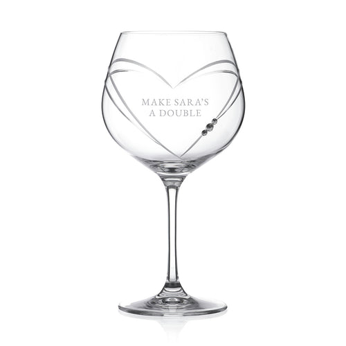 Clear wine glass with 'OLIVIA' engraved on a white background
