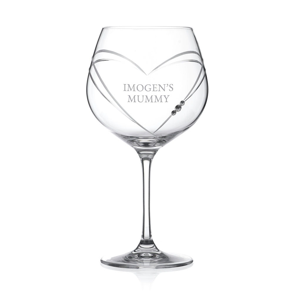 Clear wine glass with 'IMOGEN'S MUMMY' engraving on a white background