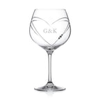 Clear wine glass with 'OLIVIA' engraved on a white background