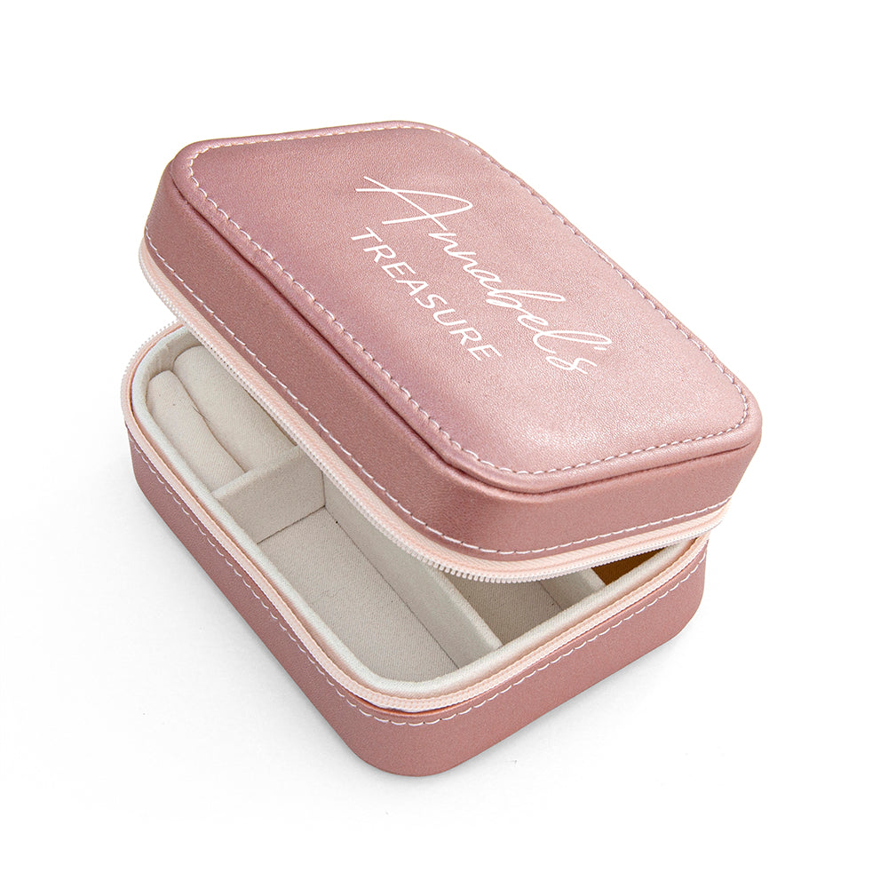 Pink jewelry box with 'Annie's Treasure' text on a white background