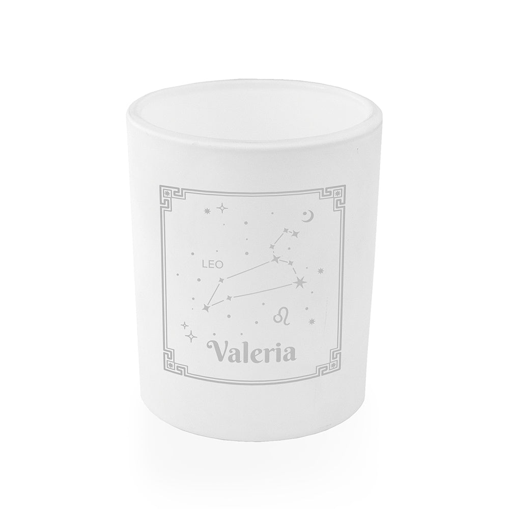 White candle with 'Valeria' and zodiac design on a white background