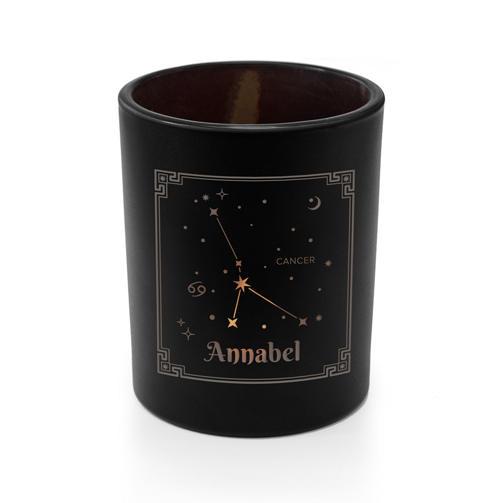 Black candle holder with star constellation design and 'Annabel' text on a white background