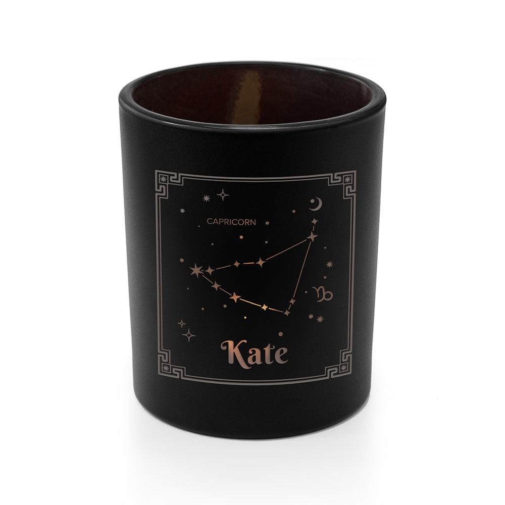 Black candle holder with Capricorn zodiac design and 'Kate' text on a white background