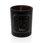 Black candle holder with Pisces constellation and name 'Nina' on a white background