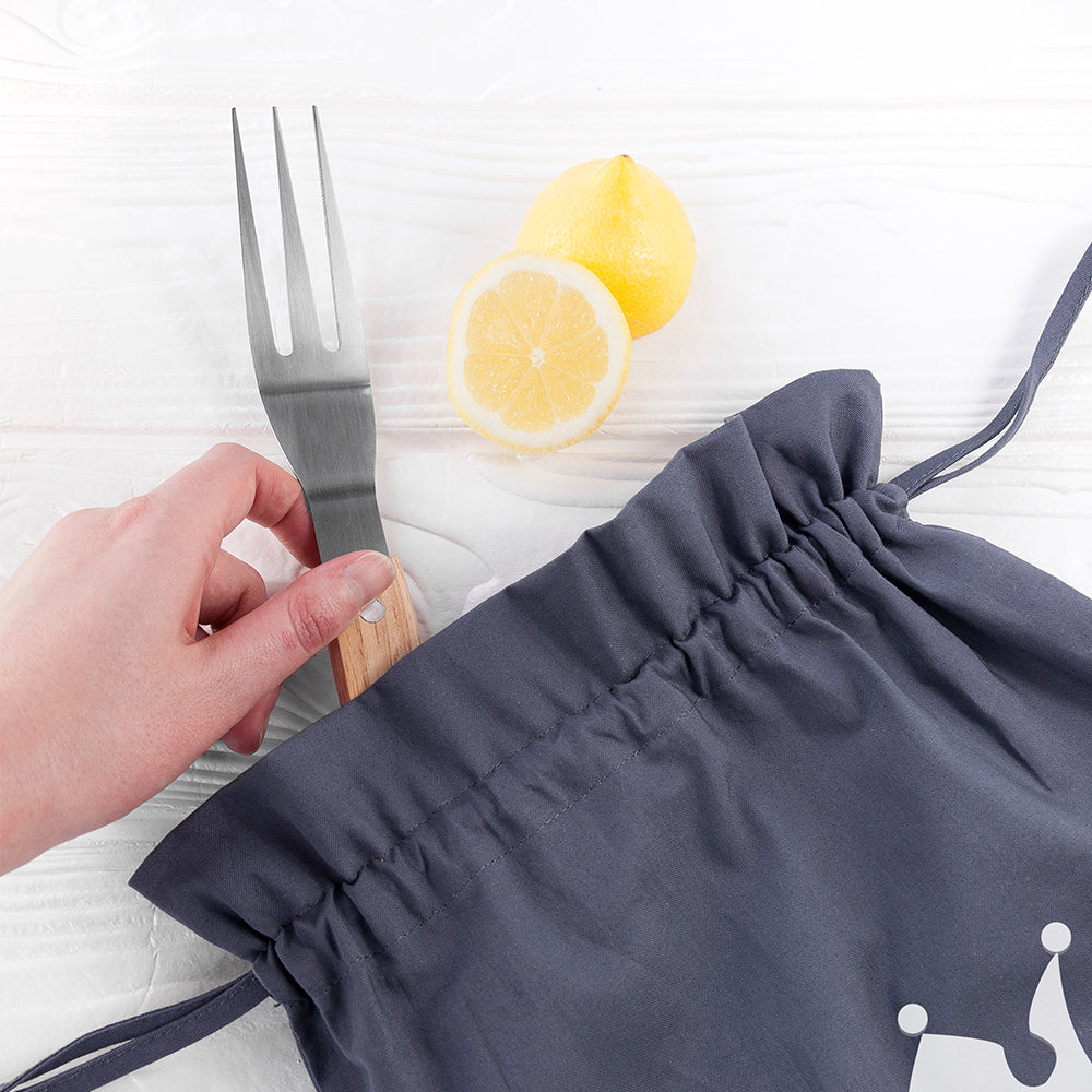 Navy blue drawstring bag with a hand holding a fork and sliced lemons on a white background