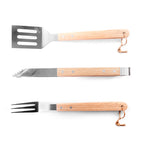 Three BBQ utensils with wooden handles on a white background