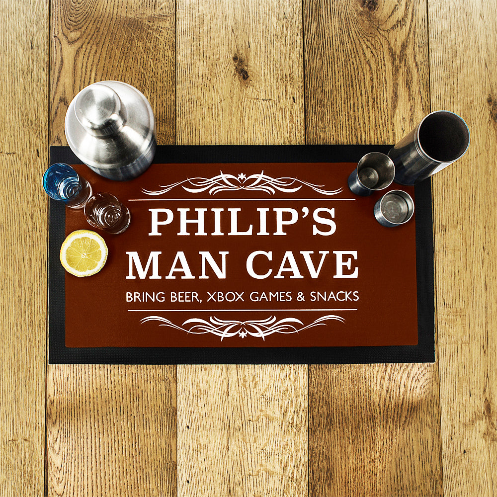 Personalized man cave sign with decorative elements on a wooden surface