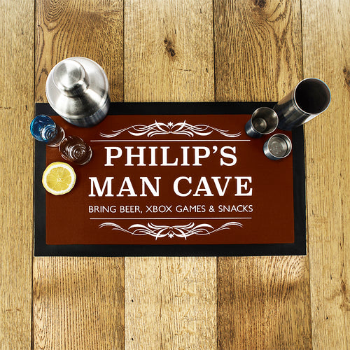 Personalized man cave sign with decorative elements on a wooden surface