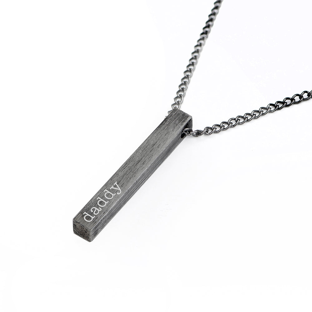 Necklace with a vertical bar pendant engraved with 'daddy' on a white background