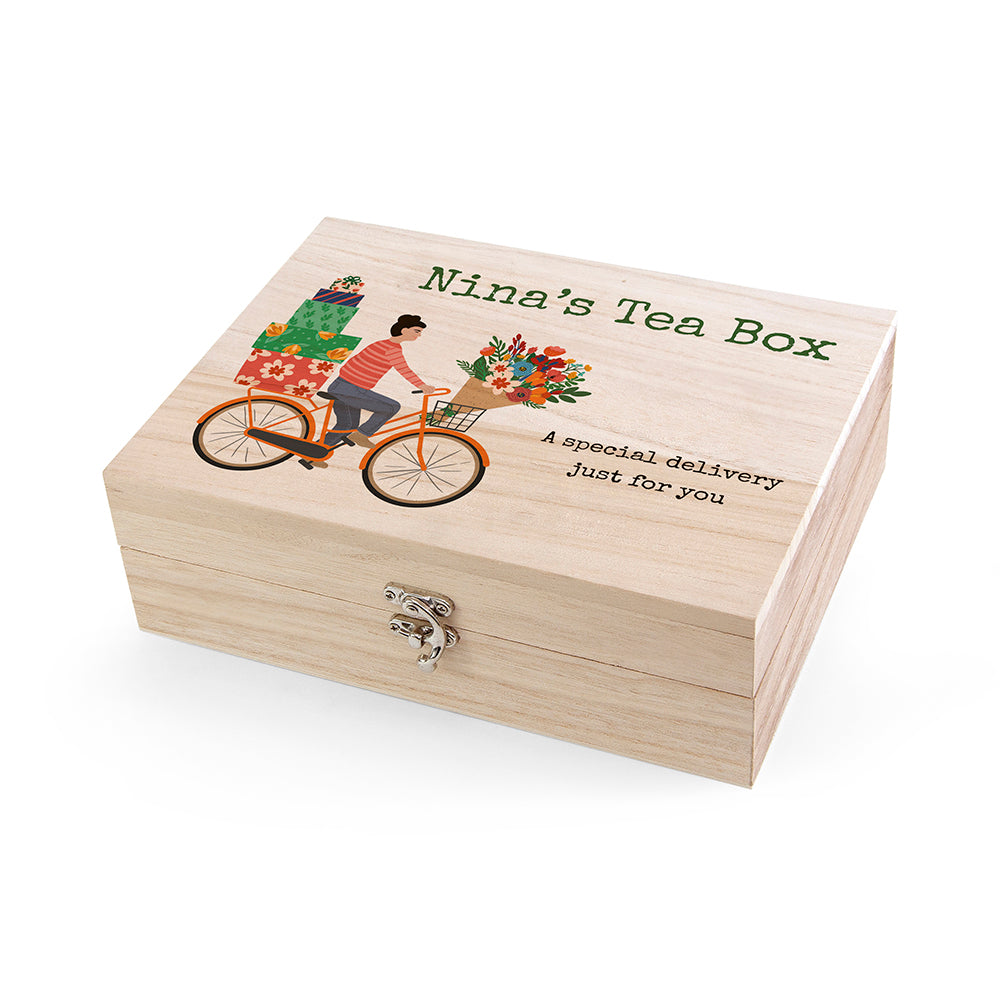 Wooden tea box with a bicycle and floral design, labeled 'Nina's Tea Box'.