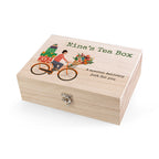 Wooden tea box with a bicycle and floral design, labeled 'Nina's Tea Box'.
