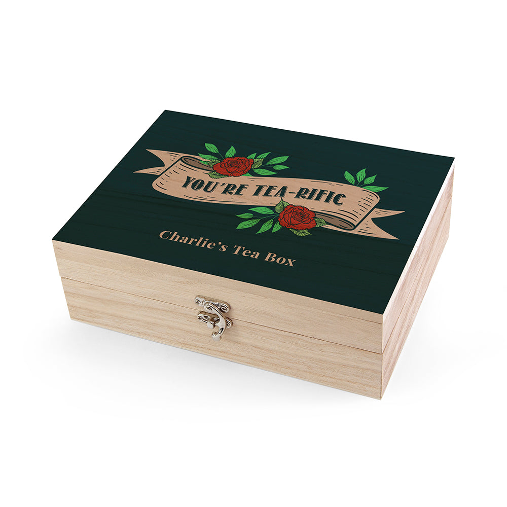 Wooden tea box with decorative lid featuring roses and text on a white background
