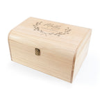 Wooden box with engraved text and design on a white background