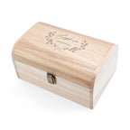 Wooden jewelry box with engraved text on a white background