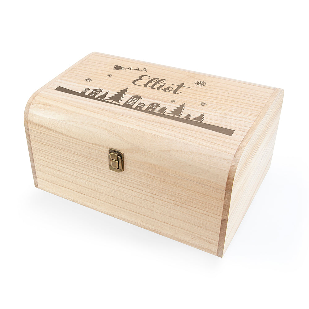 Wooden box with engraved design and name 'Elliot' on a white background