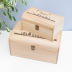 Two wooden boxes with engraved designs on a light background