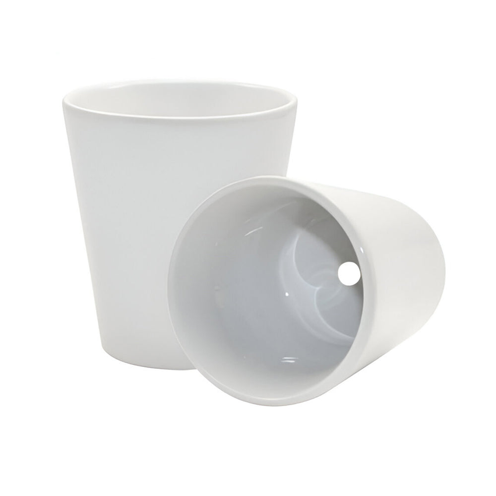 Two white ceramic cups on a white background