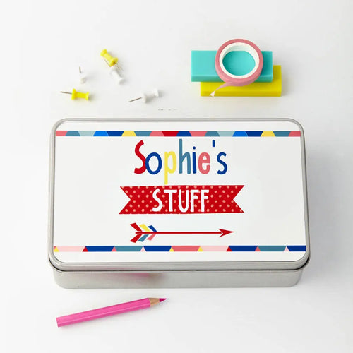 Rectangular tin labeled 'Sophie's Stuff' with colorful design on a white background