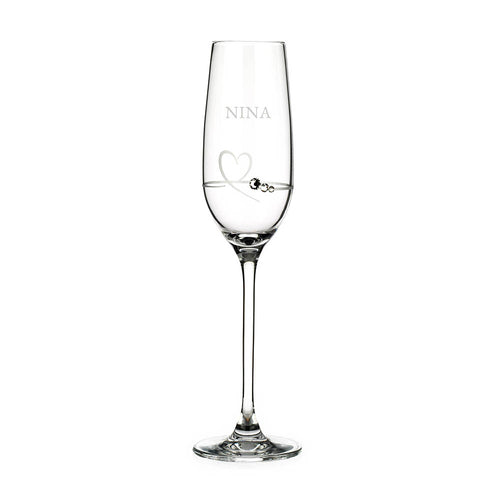 Clear glass flute with 'NINA' engraved on a white background