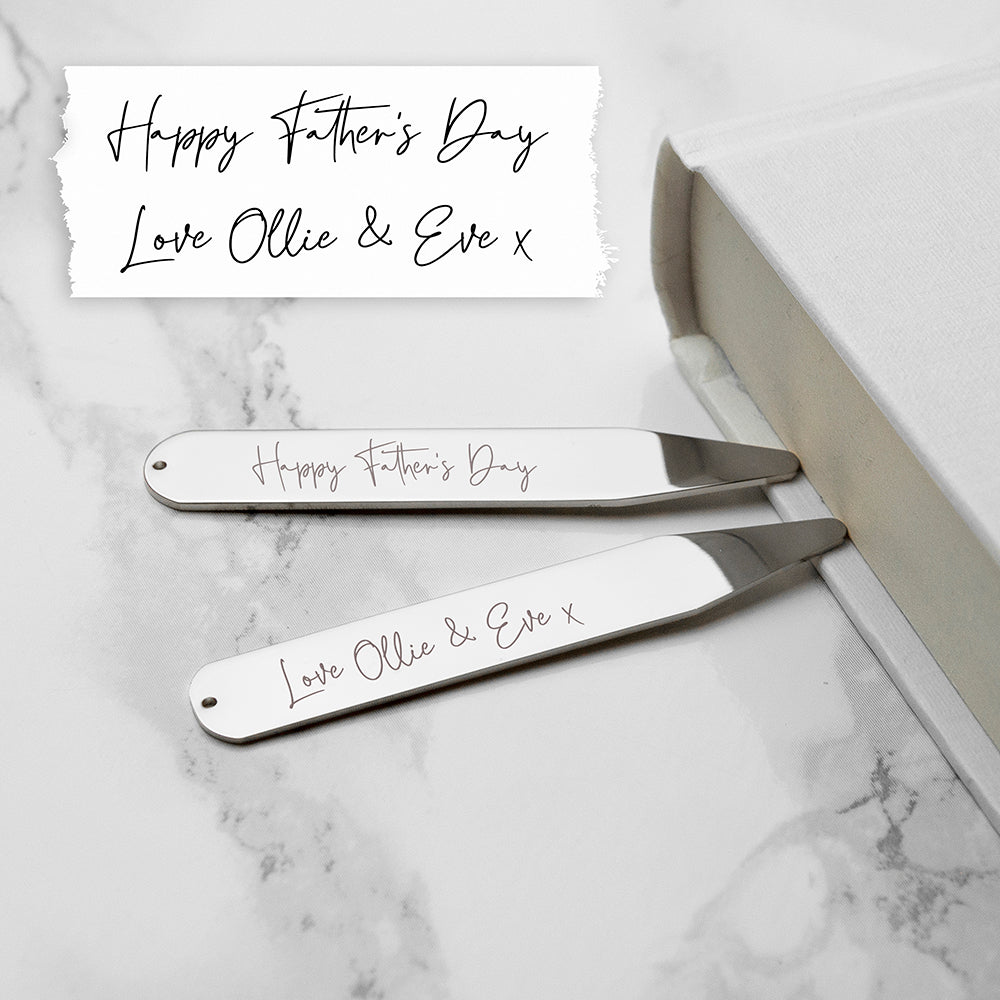 Two metal Father's Day razors with personalized message on a marble surface