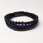 Black beaded bracelet with blue braided section on a white background