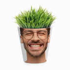 Potted plant shaped like a smiling face with glasses