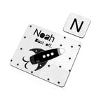 Personalized children's placemat with rocket design and name 'Noah' on a white background