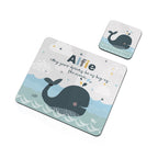 Personalized whale-themed placemat and coaster set on a white background
