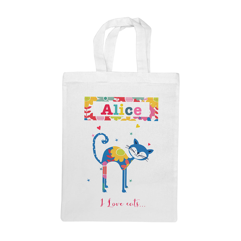 White tote bag with a colorful cat design and text on a white background
