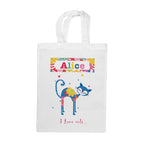 White tote bag with a colorful cat design and text on a white background