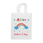 White tote bag with colorful rainbow, stars, and text on a white background