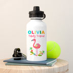 Personalized water bottle with flamingo design and text, placed on a wooden surface with a tennis ball and keys.