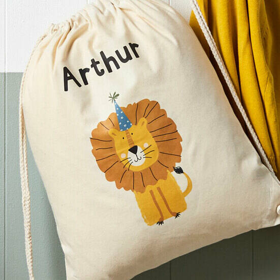 Drawstring bag with a lion illustration and 'Arthur' text on a white background